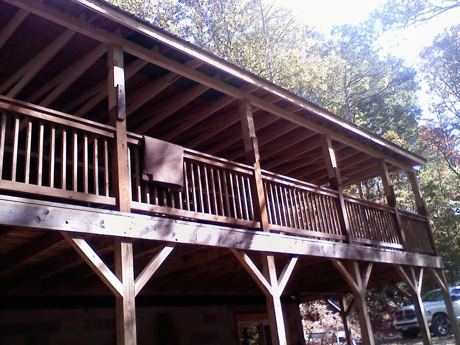 Timber framing under a new elevated porch and deck — Roof Leak Repair in Angola by Roofing Brothers